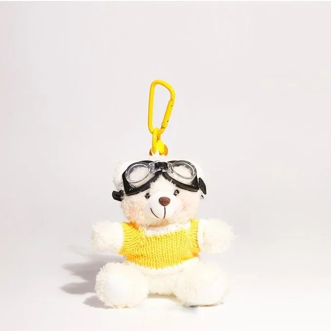 Bijou de sac ours aviateur en pull jaune