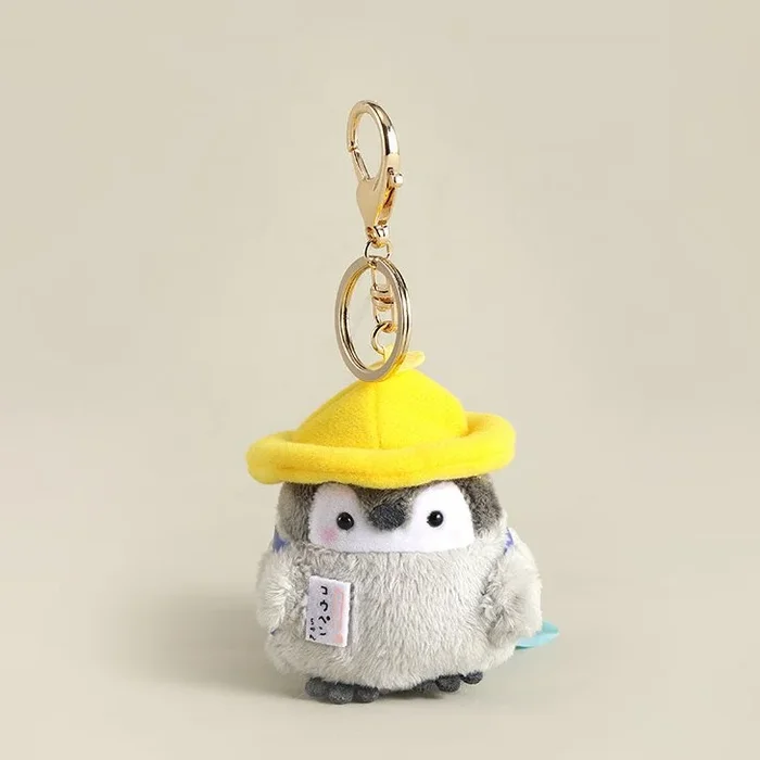 Bijou de sac pingouin au chapeau jaune